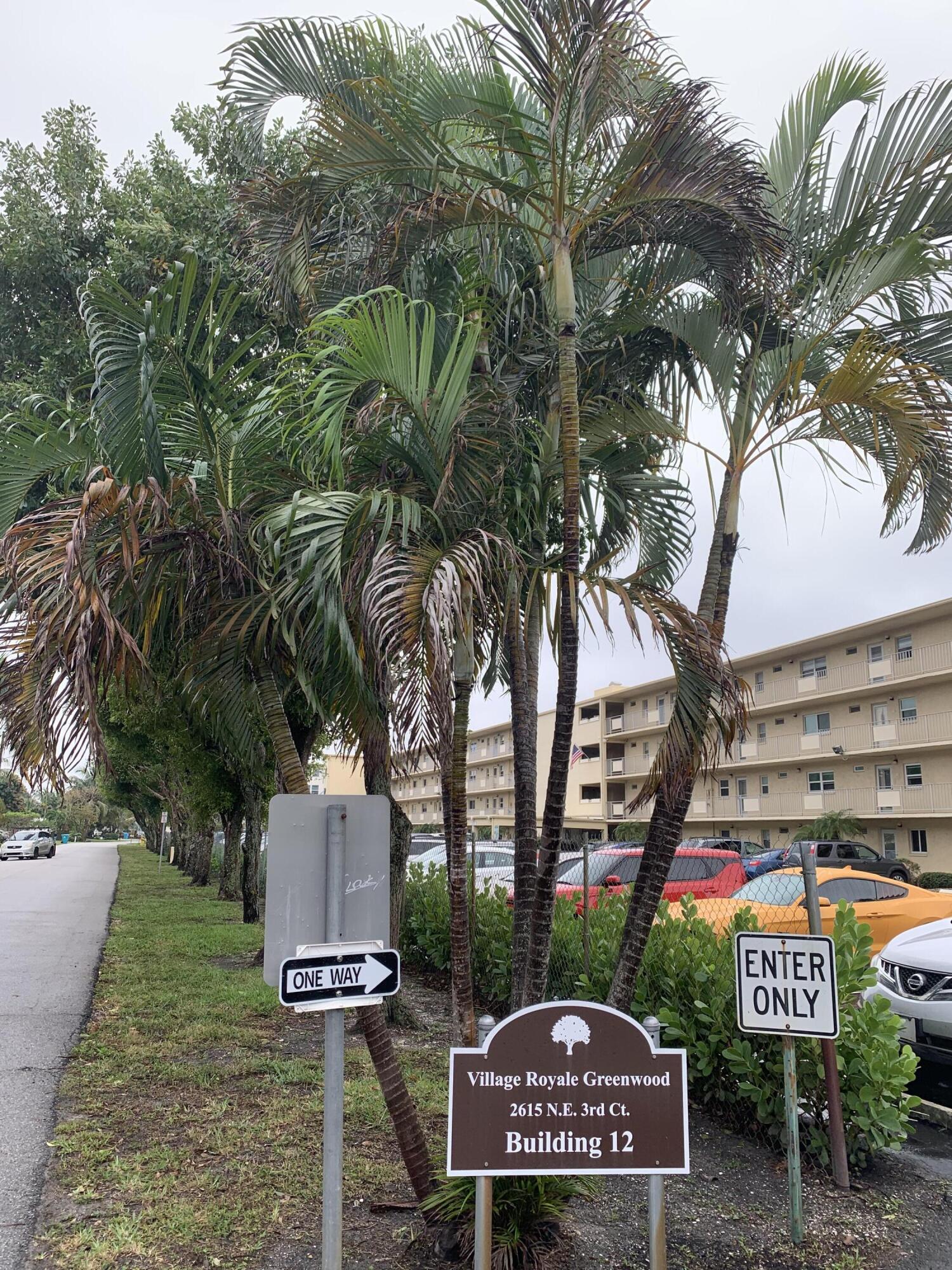 2615 Northeast 3rd Street, Unit 317 Boynton Beach, FL 33435 - Photo 40 of 41 a sign that is on the next to a road