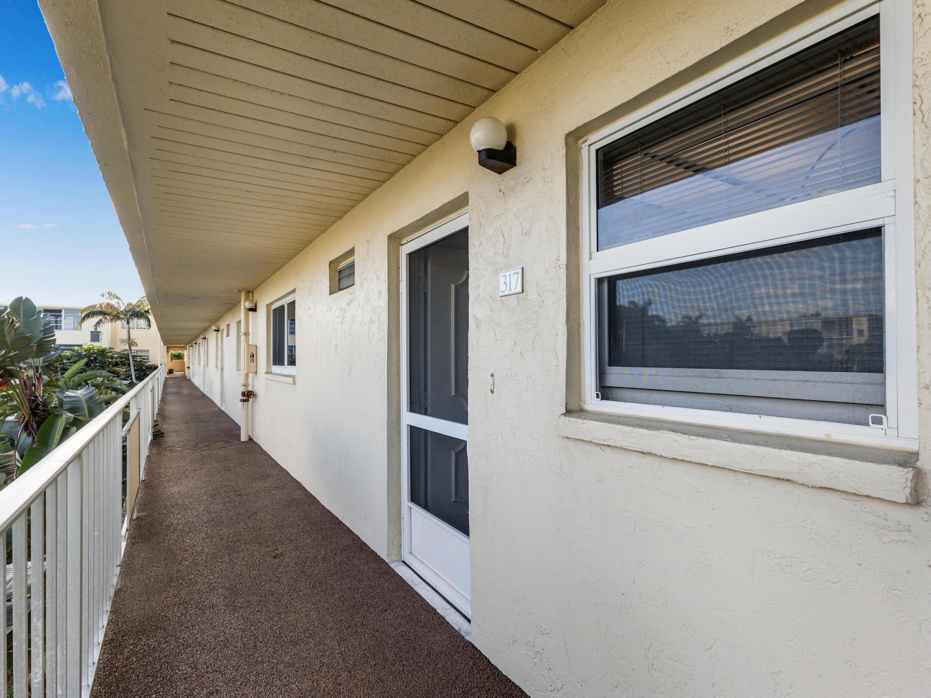 2615 Northeast 3rd Street, Unit 317 Boynton Beach, FL 33435 - Photo 4 of 41 a view of a house with stairs