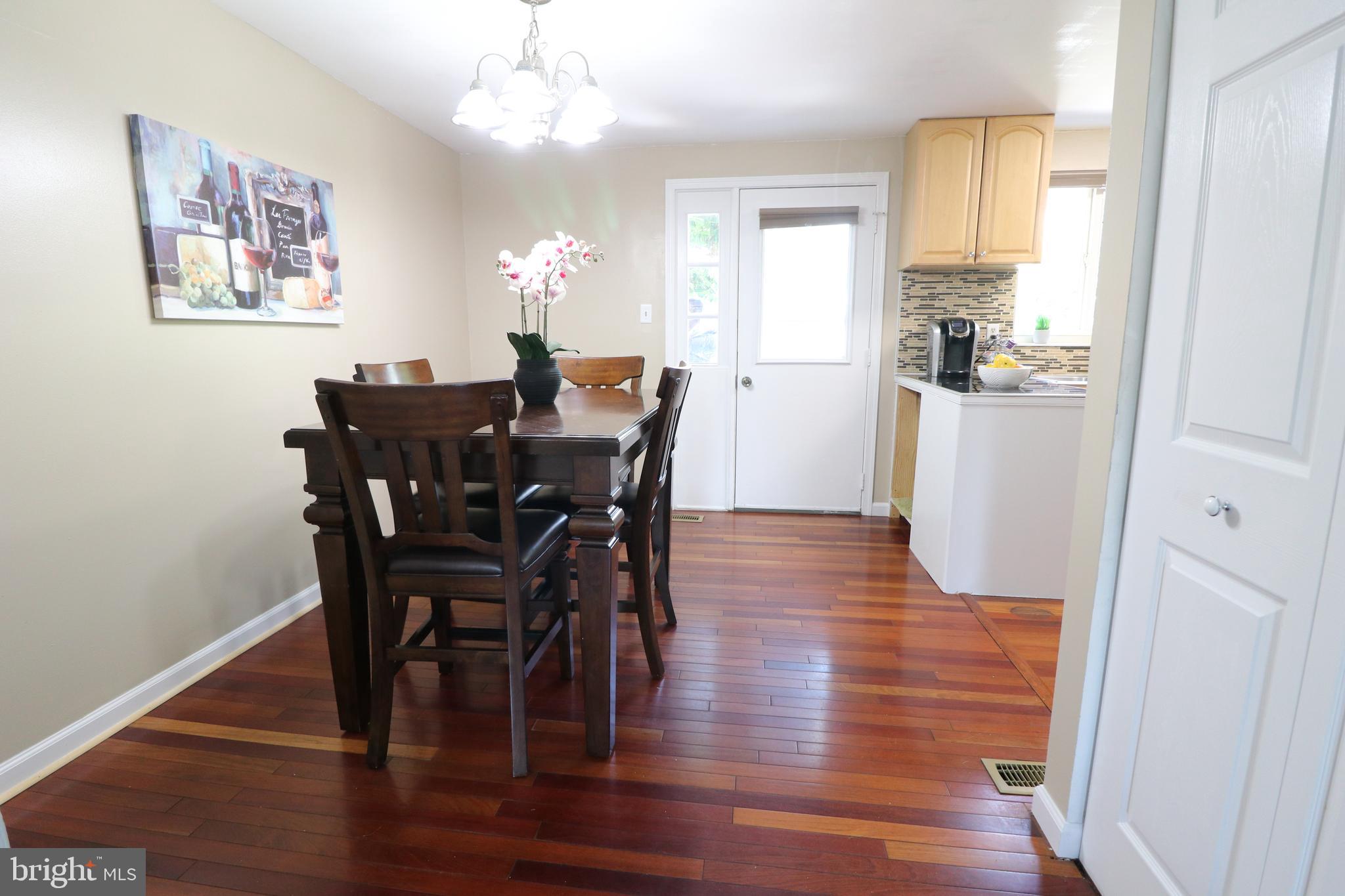 1707 Springhouse Court Frederick, MD 21702 - Photo 7 of 29 Dining room open to kitchen with access to yard