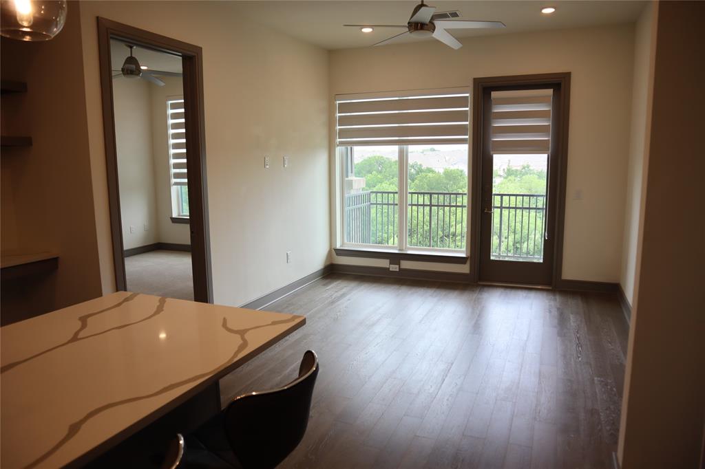 2700 Old Denton Road, Unit 3314 Carrollton, TX 75007 - Photo 5 of 14 a view of a room with window and hardwood floor