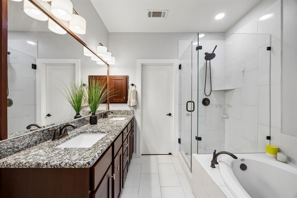 5875 Ross Avenue, Unit 9 Dallas, TX 75206 - Photo 17 of 29 Bathroom featuring double vanity, separate shower, garden tub, and recessed lighting