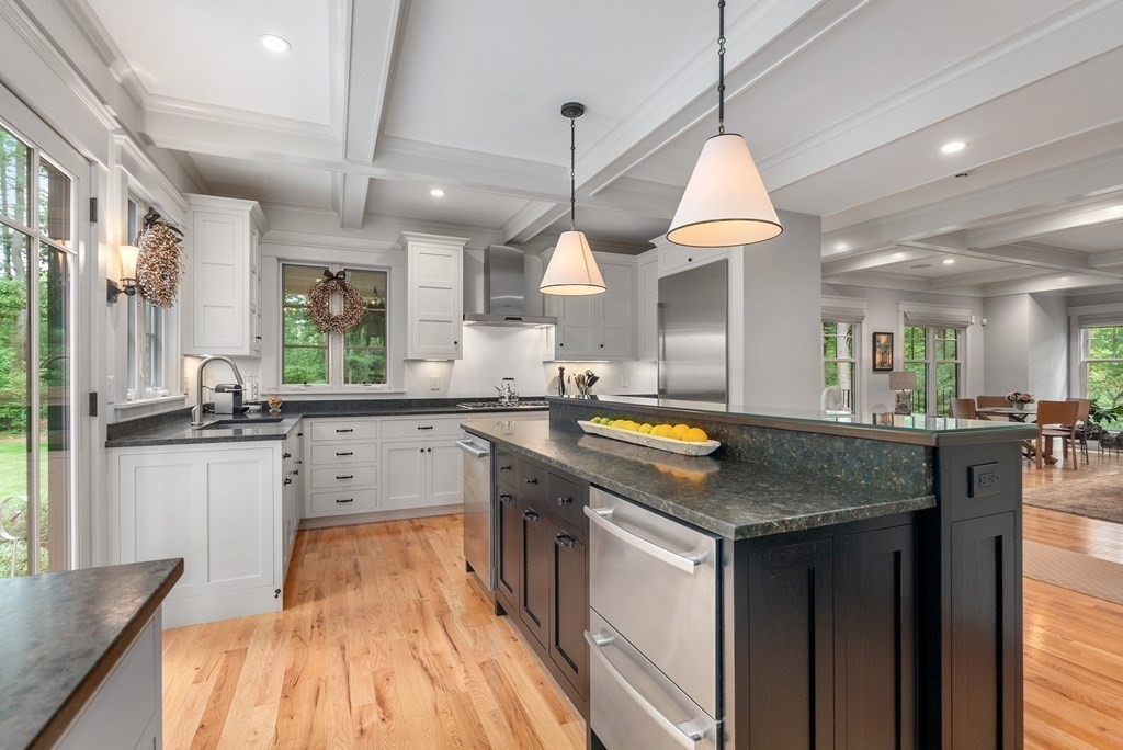 103 Conant Road Weston, MA 02493 - Photo 14 of 42 a kitchen with stainless steel appliances granite countertop a sink a stove and a wooden floors