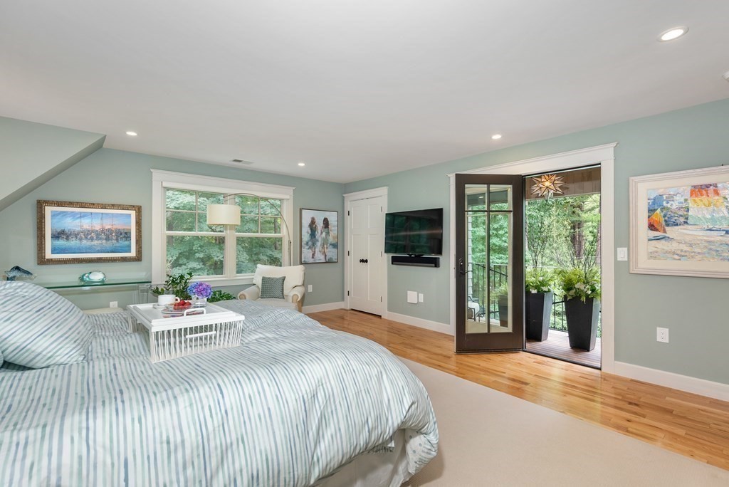 103 Conant Road Weston, MA 02493 - Photo 23 of 42 a bedroom with a bed and a large window