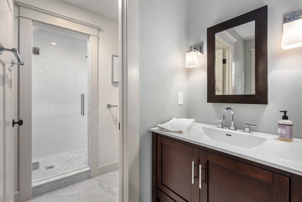 103 Conant Road Weston, MA 02493 - Photo 27 of 42 a bathroom with a sink vanity and a mirror