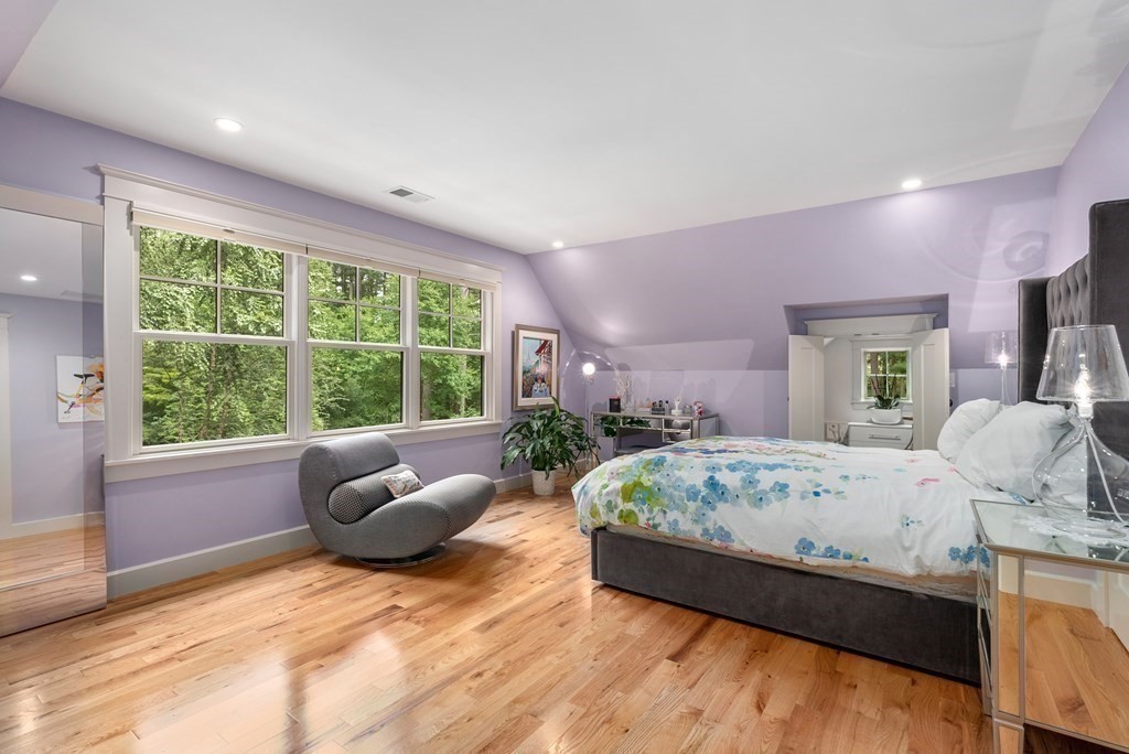 103 Conant Road Weston, MA 02493 - Photo 29 of 42 a bedroom with a bed and large windows