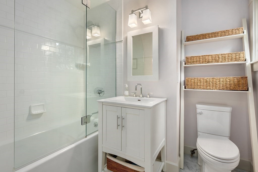 103 Conant Road Weston, MA 02493 - Photo 30 of 42 a bathroom with a sink a toilet and shower