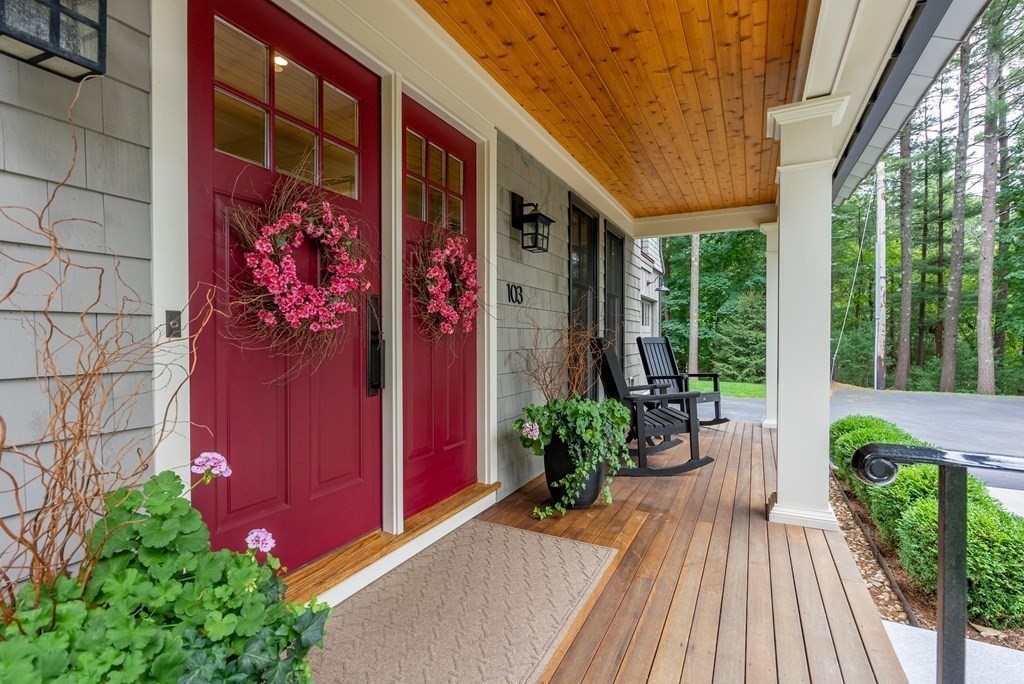 103 Conant Road Weston, MA 02493 - Photo 3 of 42 a view of a house with a potted plant and floor to ceiling window