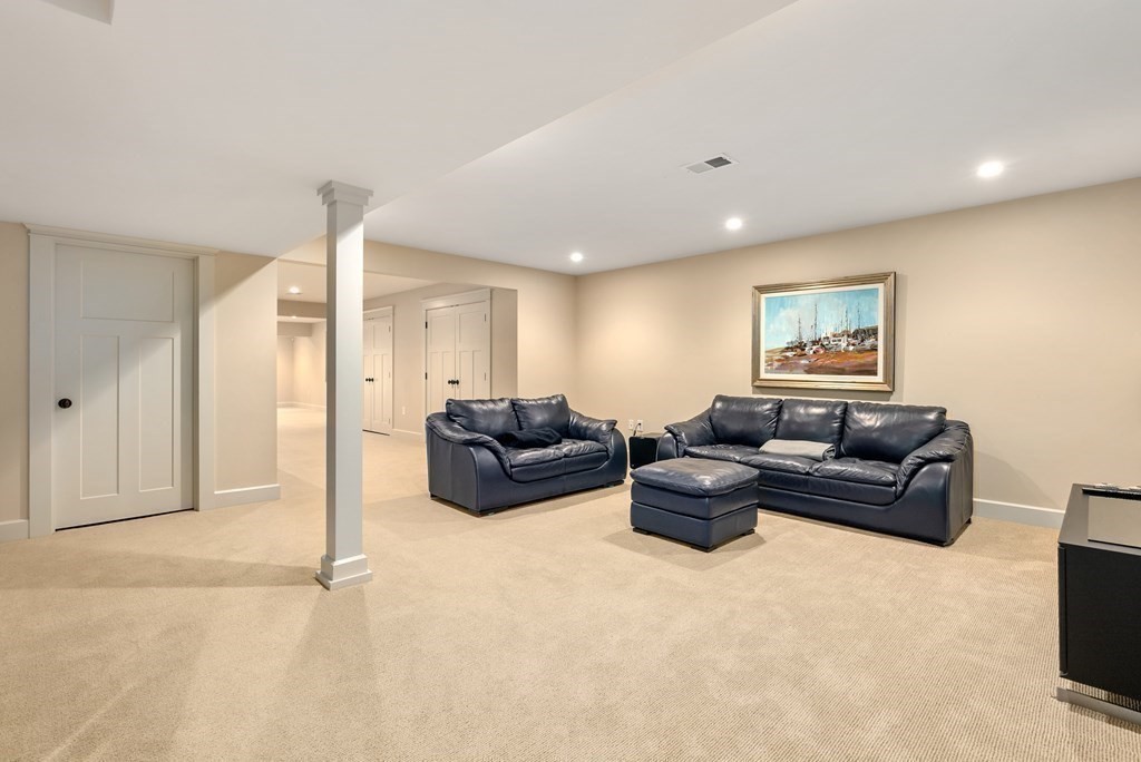 103 Conant Road Weston, MA 02493 - Photo 33 of 42 a living room with furniture and a flat screen tv
