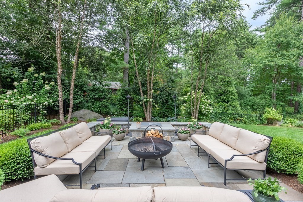 103 Conant Road Weston, MA 02493 - Photo 40 of 42 a view of a patio with couches table and chairs and potted plants