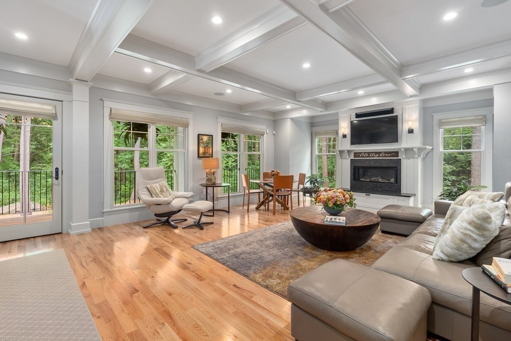 103 Conant Road Weston, MA 02493 - Photo 6 of 42 a living room with furniture a fireplace and a large window