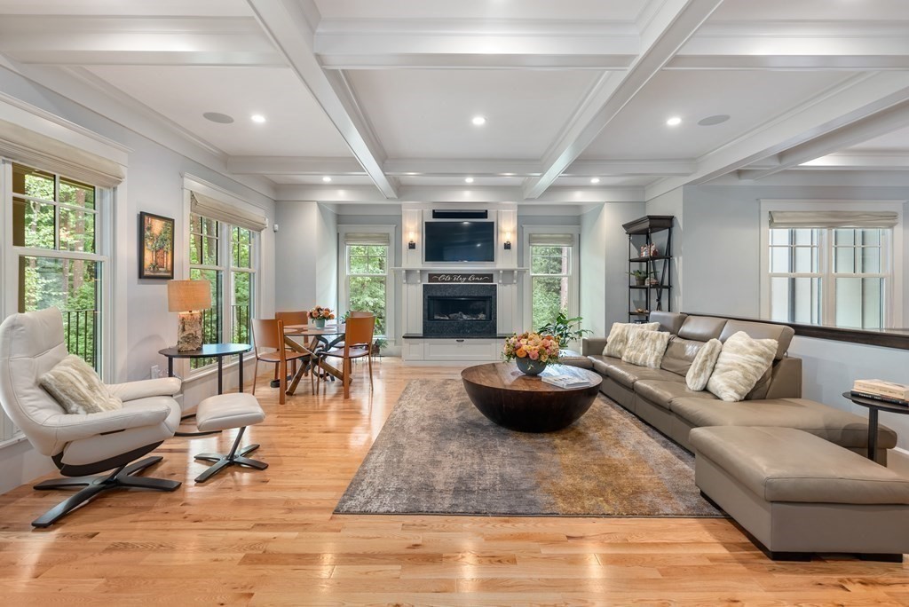 103 Conant Road Weston, MA 02493 - Photo 8 of 42 a living room with furniture and a fireplace