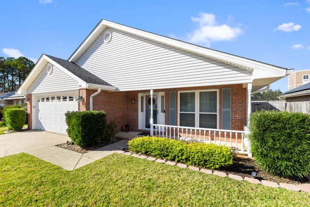 a front view of a house with garden