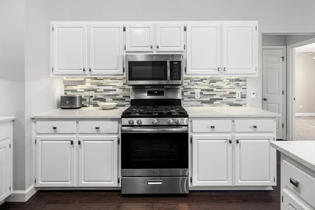 a view of a house with swimming pool and a yard