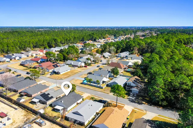 an aerial view of residential houses with outdoor space