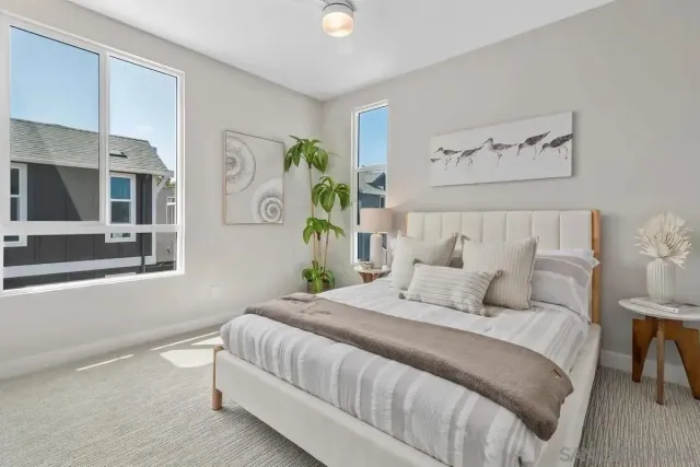 a bedroom with bed and a window