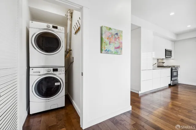 a view of a hallway with washer and dryer