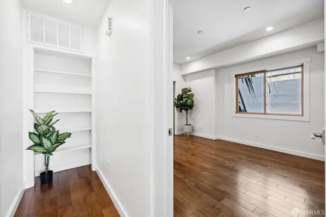 a view of an entryway with wooden floor