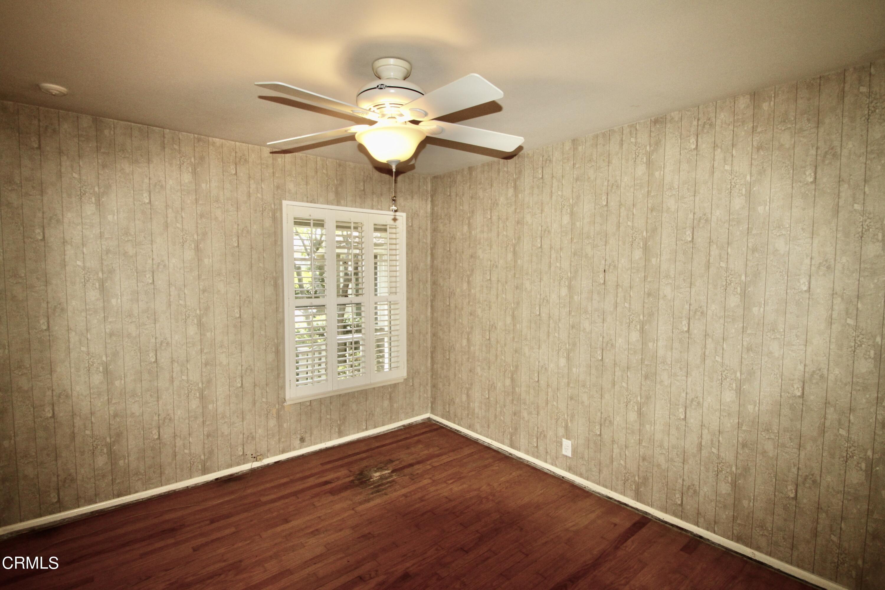 310 Santa Rosa Road Arcadia, CA 91007 - Photo 11 of 21 an empty room with wooden floor and windows