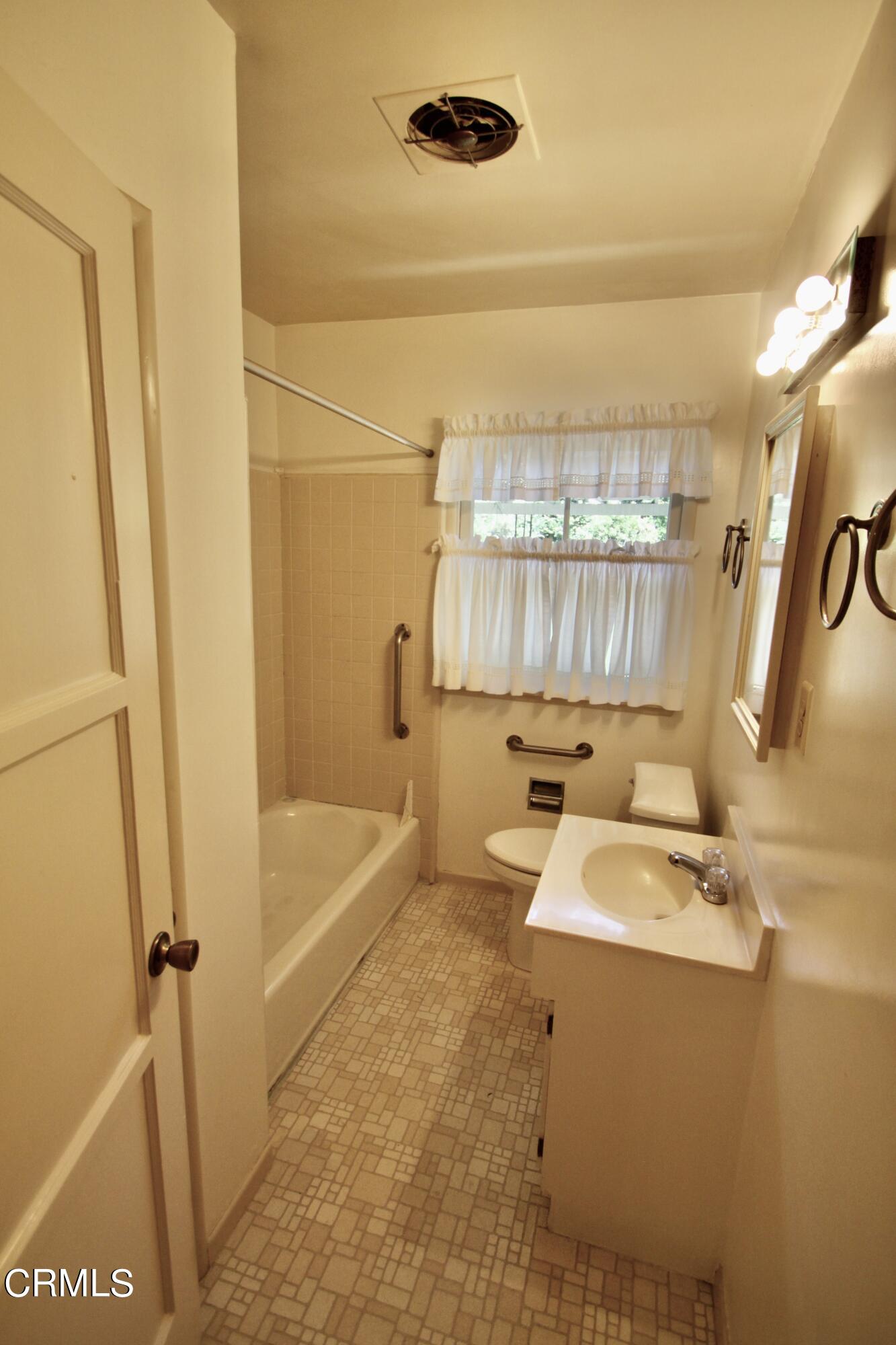 310 Santa Rosa Road Arcadia, CA 91007 - Photo 13 of 21 a bathroom with a sink a toilet a tub and shower