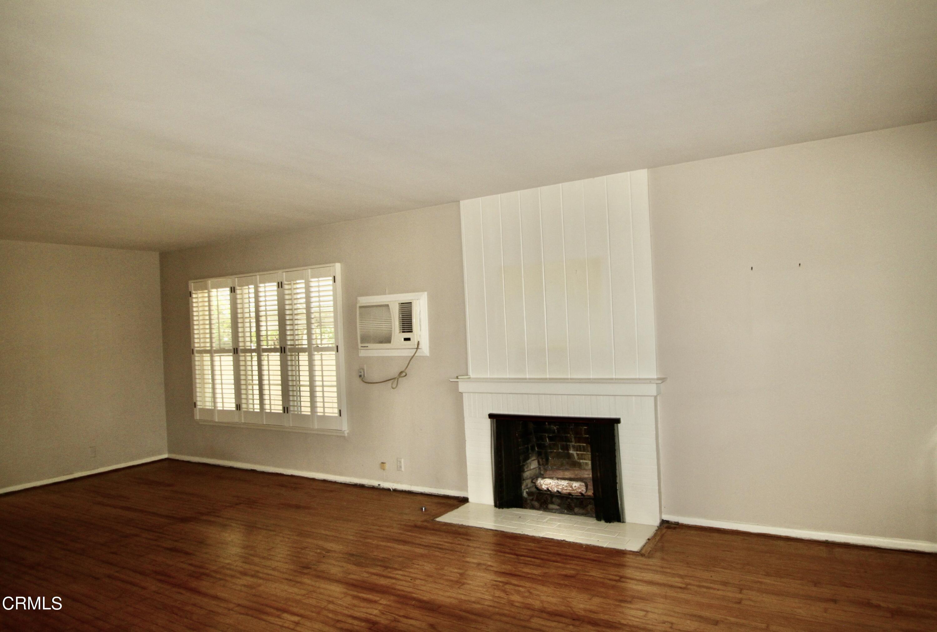 310 Santa Rosa Road Arcadia, CA 91007 - Photo 2 of 21 a view of an empty room with wooden floor and a window