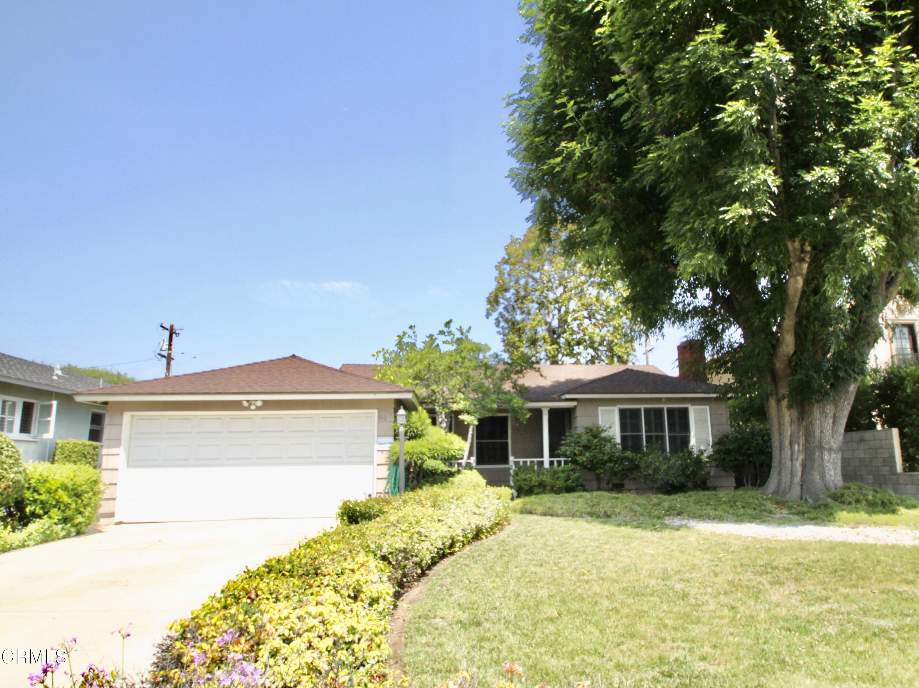 310 Santa Rosa Road Arcadia, CA 91007 - Photo 21 of 21 a front view of a house with a yard and garage