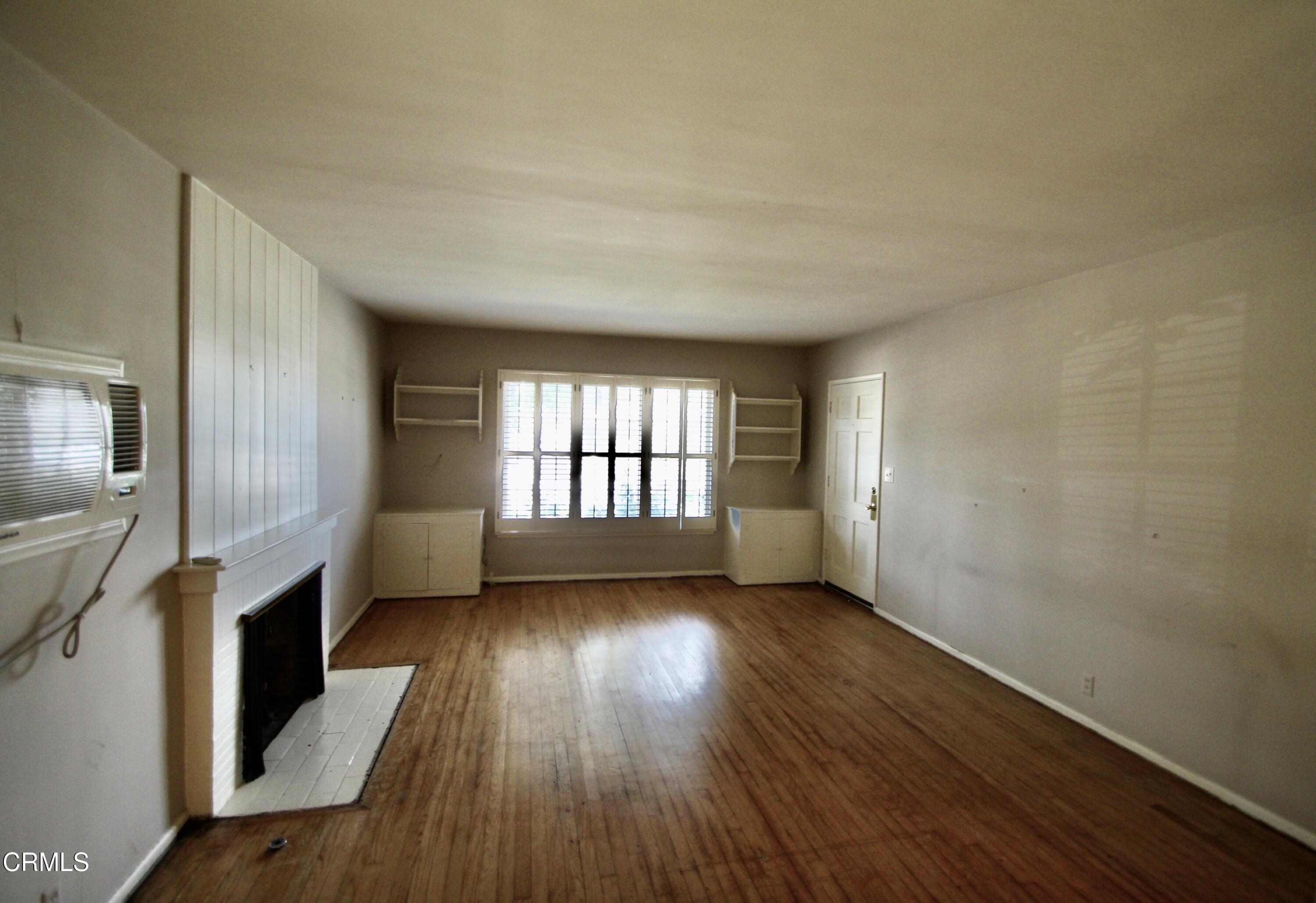 310 Santa Rosa Road Arcadia, CA 91007 - Photo 4 of 21 wooden floor in an empty room with a window