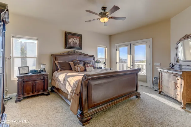 a bed room with a bed and a chandelier