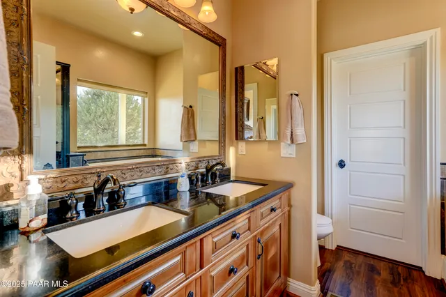 a kitchen with sink refrigerator and window