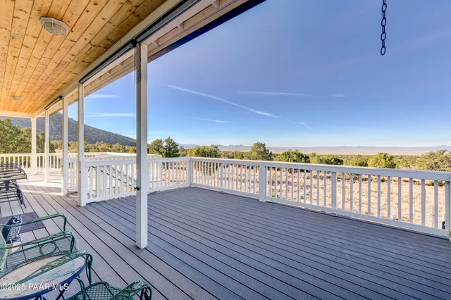 a view of balcony with wooden floor