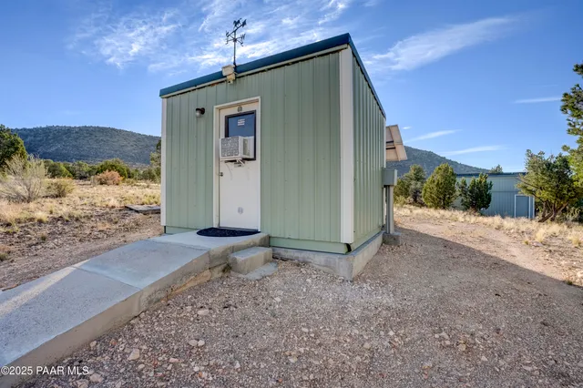 a view of a house with a snow in the yard