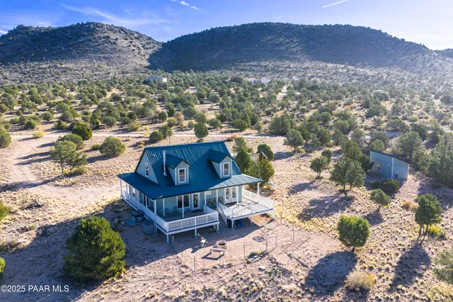 a view of a house with a mountain