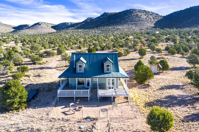 a view of a balcony with a table and chairs