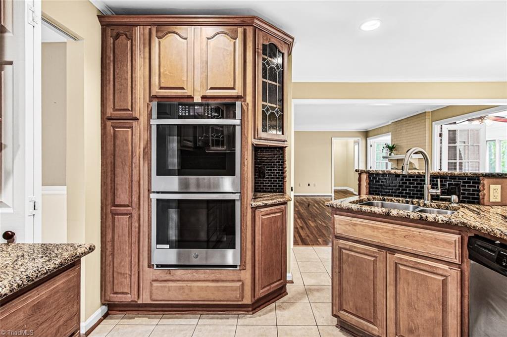 3903 Oakcliffe Road Greensboro, NC 27406 - Photo 13 of 42 Double ovens and plenty of cabinet, and pull out shelving.