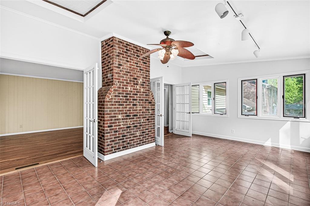 3903 Oakcliffe Road Greensboro, NC 27406 - Photo 20 of 42 Sunroom view to the den.