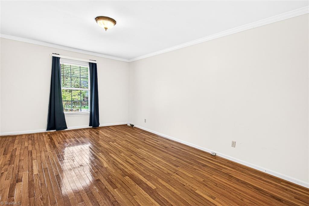 3903 Oakcliffe Road Greensboro, NC 27406 - Photo 22 of 42 Main level primary bedroom.