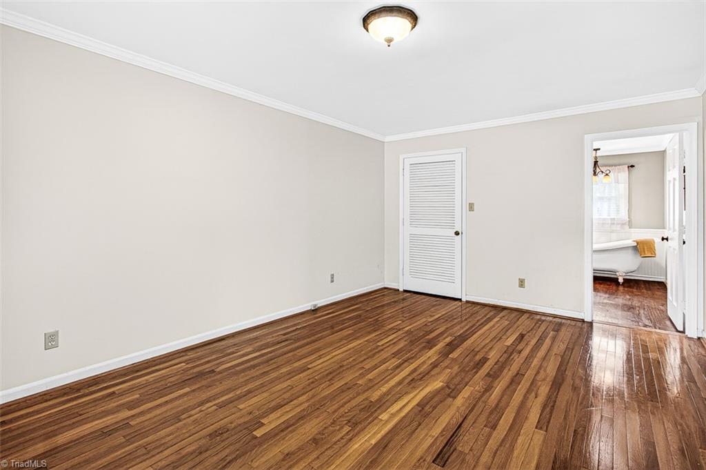 3903 Oakcliffe Road Greensboro, NC 27406 - Photo 23 of 42 Primary bedroom with en-suite bath.