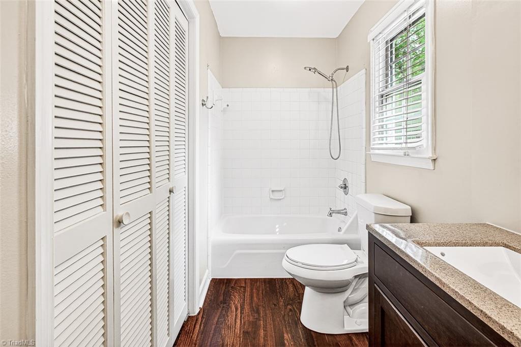 3903 Oakcliffe Road Greensboro, NC 27406 - Photo 33 of 42 Upper hall bath with tub / shower combo and large linen closet.
