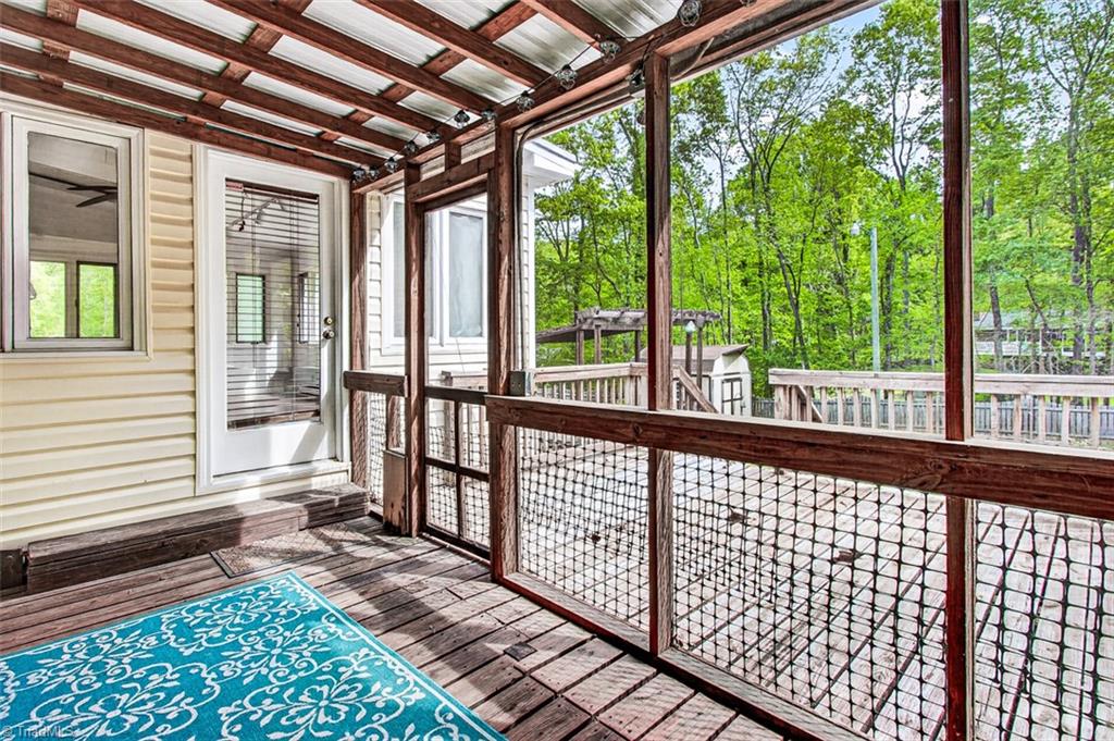 3903 Oakcliffe Road Greensboro, NC 27406 - Photo 36 of 42 Screen porch opens to the deck.