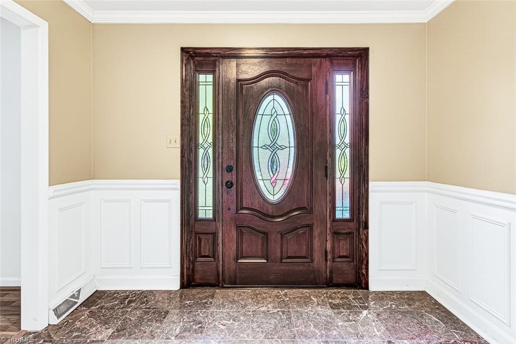 3903 Oakcliffe Road Greensboro, NC 27406 - Photo 5 of 42 Front door with leaded glass side lights.