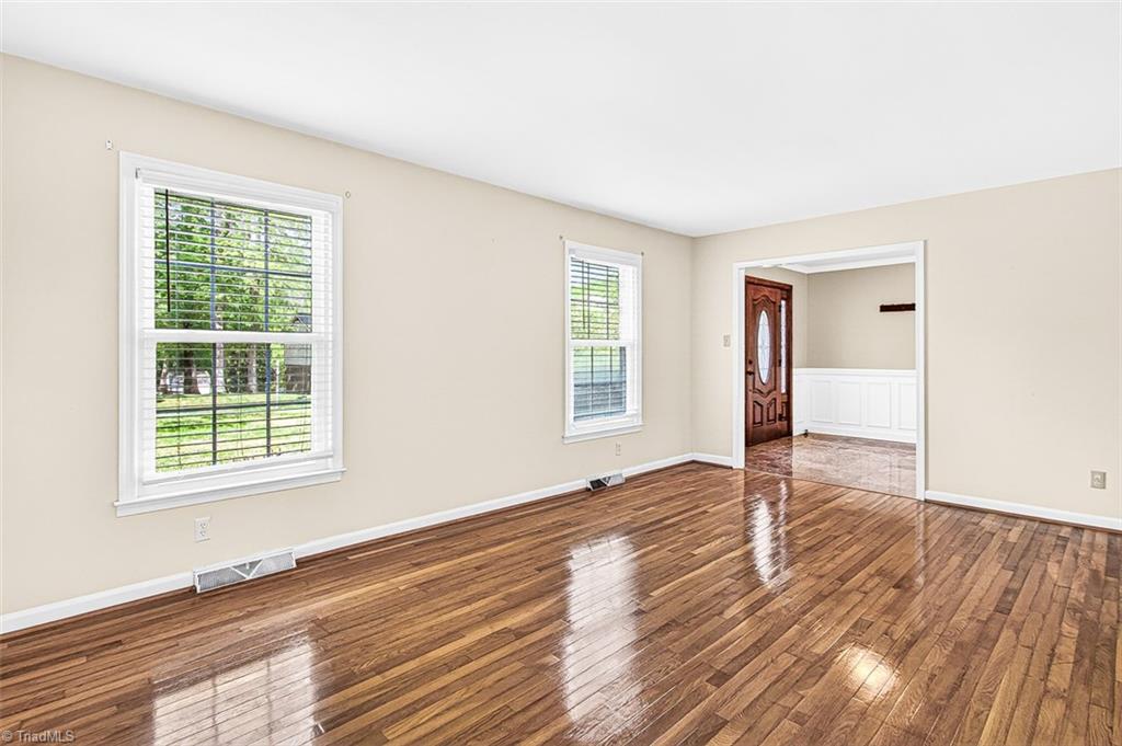3903 Oakcliffe Road Greensboro, NC 27406 - Photo 6 of 42 Formal living room with hardwood flooring.