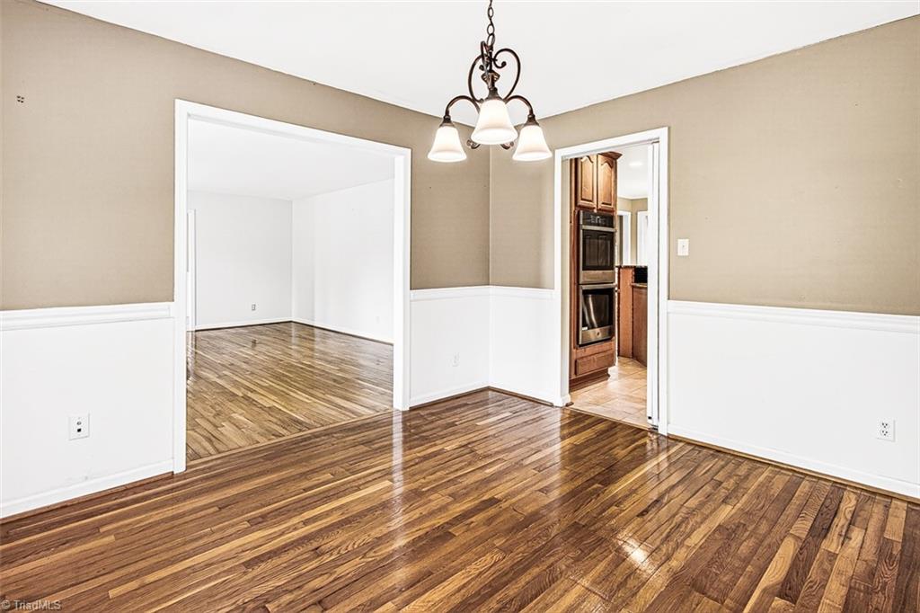 3903 Oakcliffe Road Greensboro, NC 27406 - Photo 10 of 42 Formal dining room view to the kitchen.