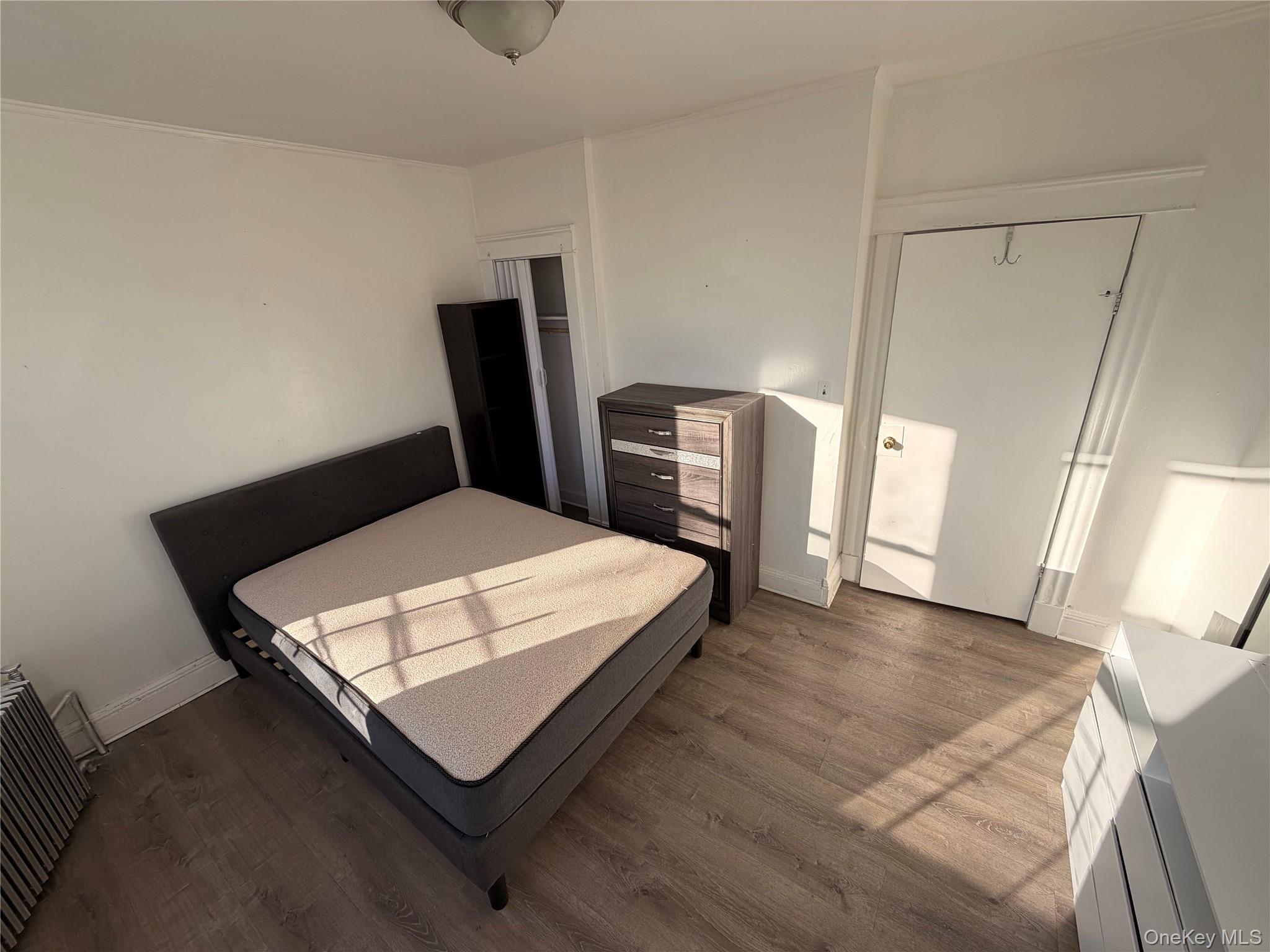 13 Cedar Street, Unit 3 Yonkers, NY 10701 - Photo 4 of 12 a bedroom with a bed a rug and a mirror