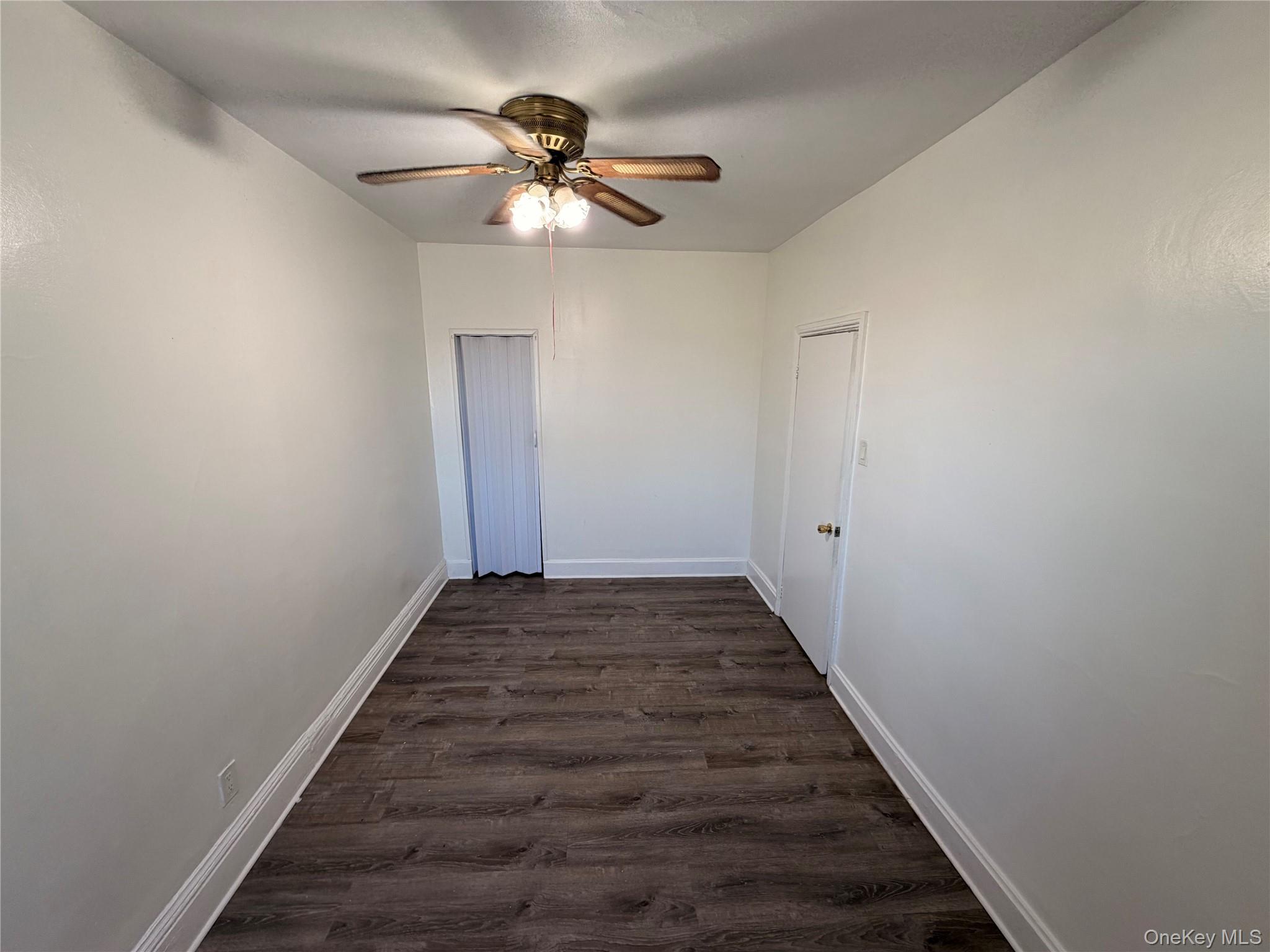13 Cedar Street, Unit 3 Yonkers, NY 10701 - Photo 5 of 12 a view of a hallway with wooden floor and staircase