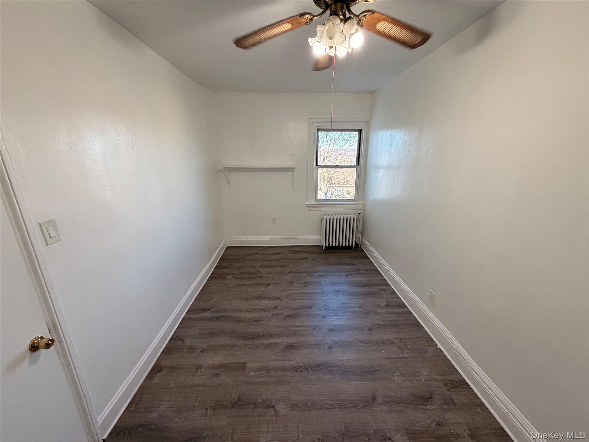13 Cedar Street, Unit 3 Yonkers, NY 10701 - Photo 6 of 12 an empty room with wooden floor fan and windows