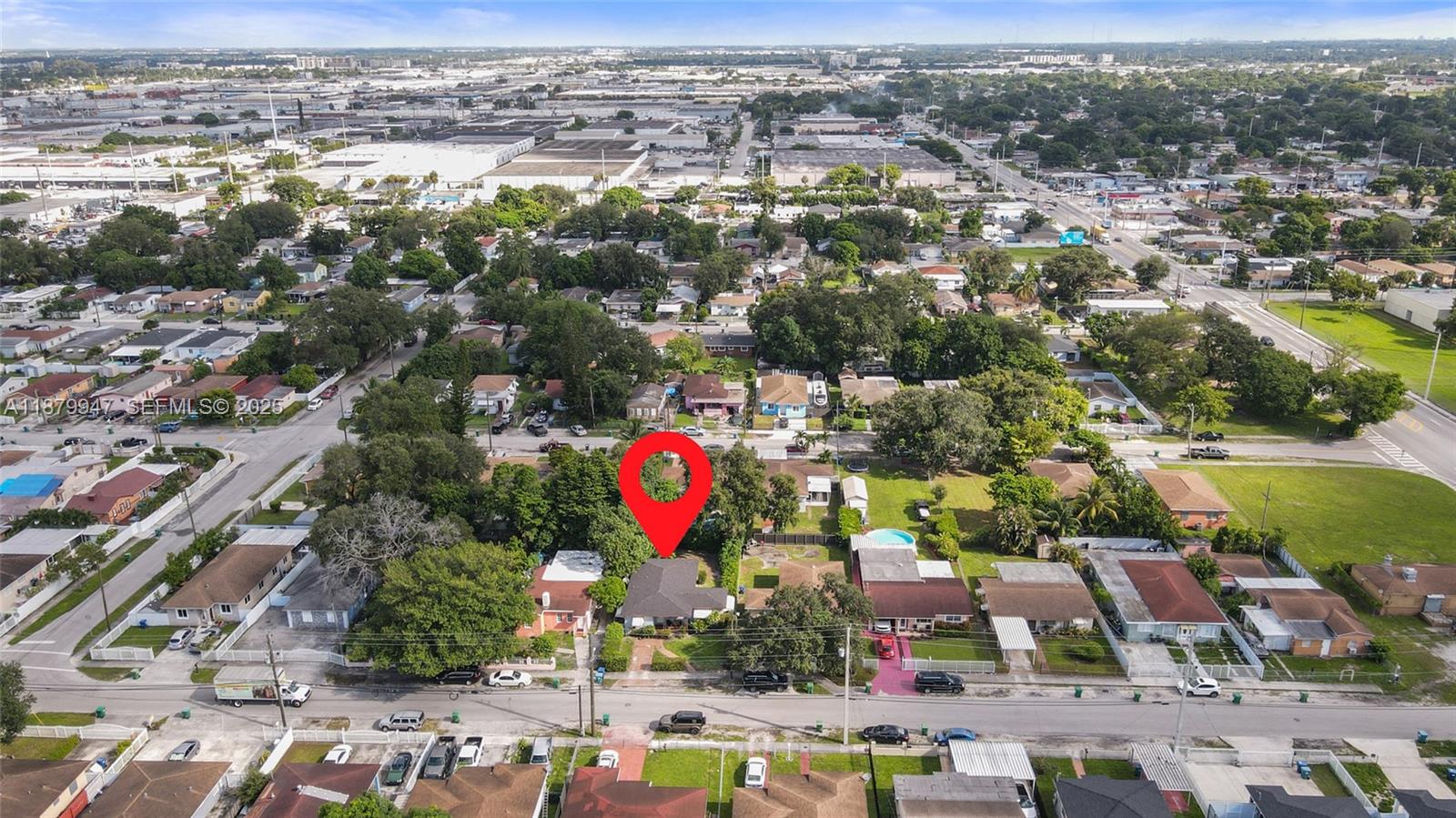 3265 Northwest 50th Street Miami, FL 33142 - Photo 15 of 17 an aerial view of residential houses with outdoor space and parking space