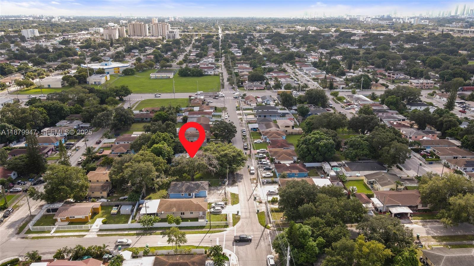 3265 Northwest 50th Street Miami, FL 33142 - Photo 16 of 17 an aerial view of residential houses with outdoor space