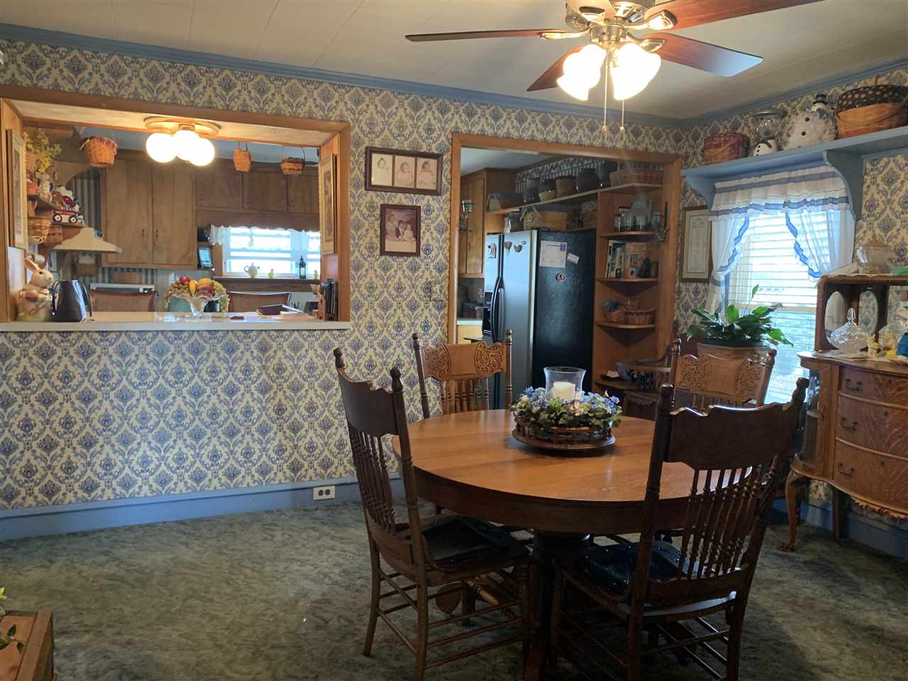 1099 B Battlefield Road Grottoes, VA 24441 - Photo 11 of 27 a view of a dining room with furniture and window