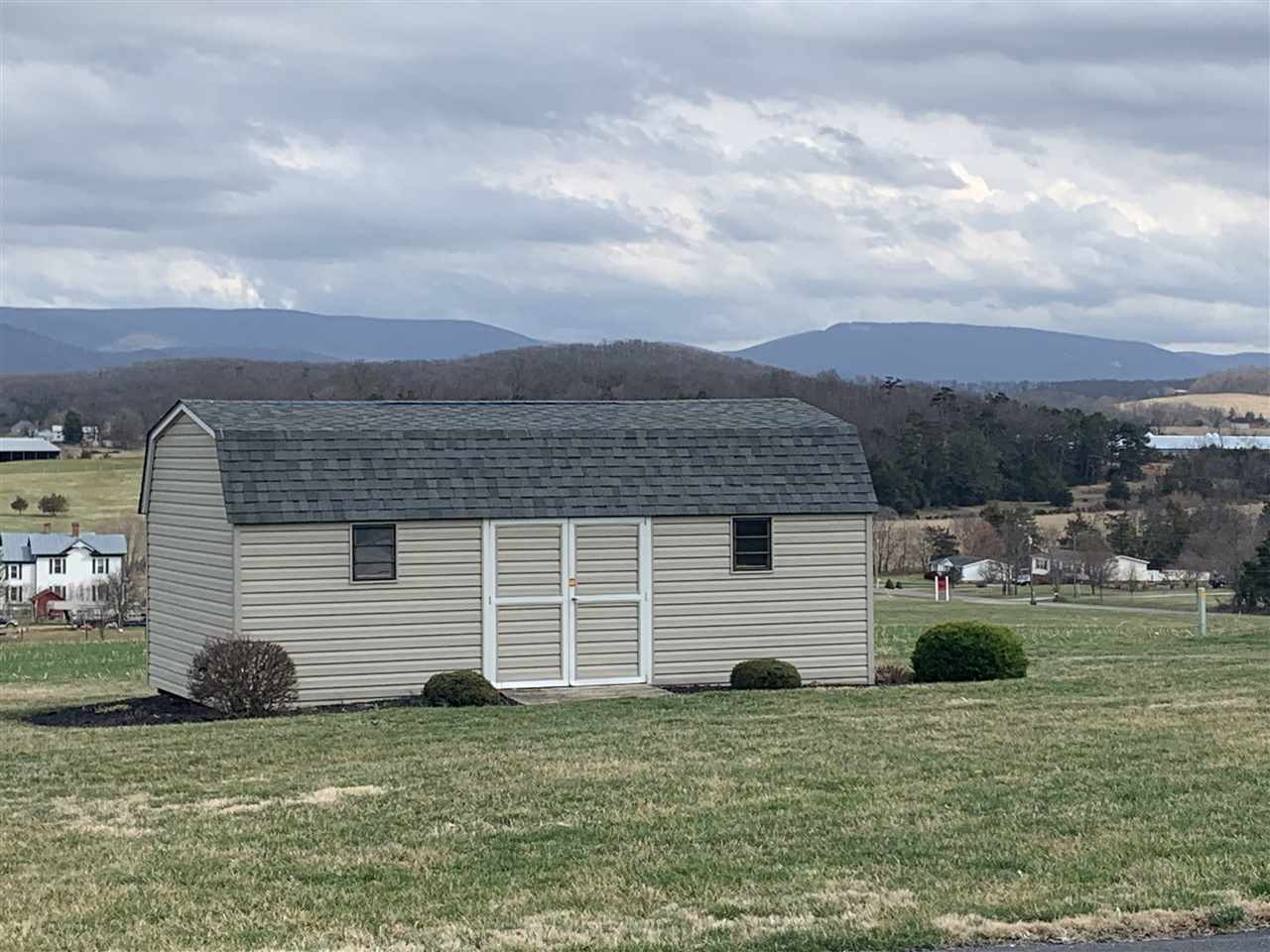 1099 B Battlefield Road Grottoes, VA 24441 - Photo 25 of 27 a front view of a house with a garden