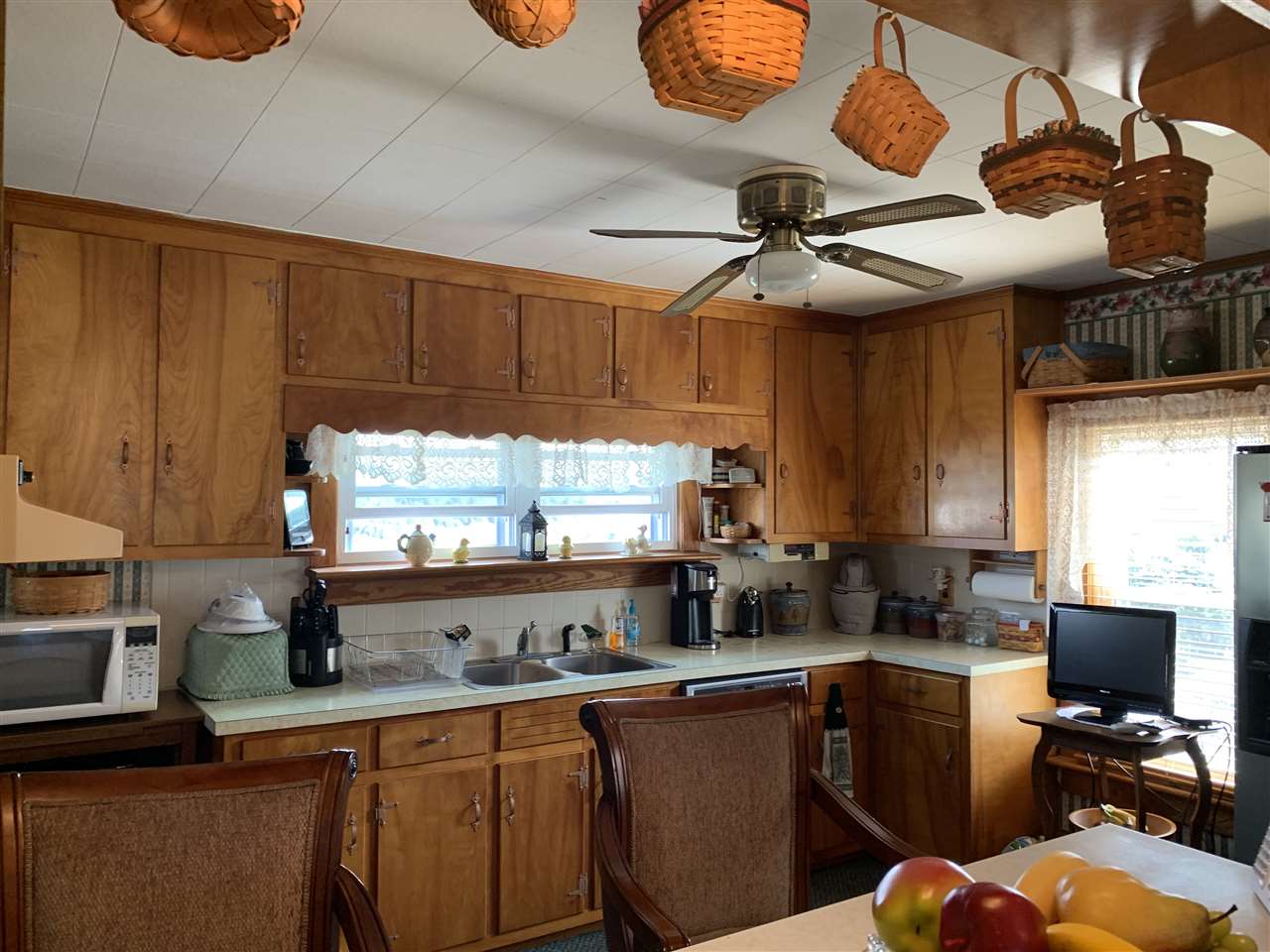 1099 B Battlefield Road Grottoes, VA 24441 - Photo 9 of 27 a kitchen with stainless steel appliances granite countertop a sink a stove cabinets and a dining table