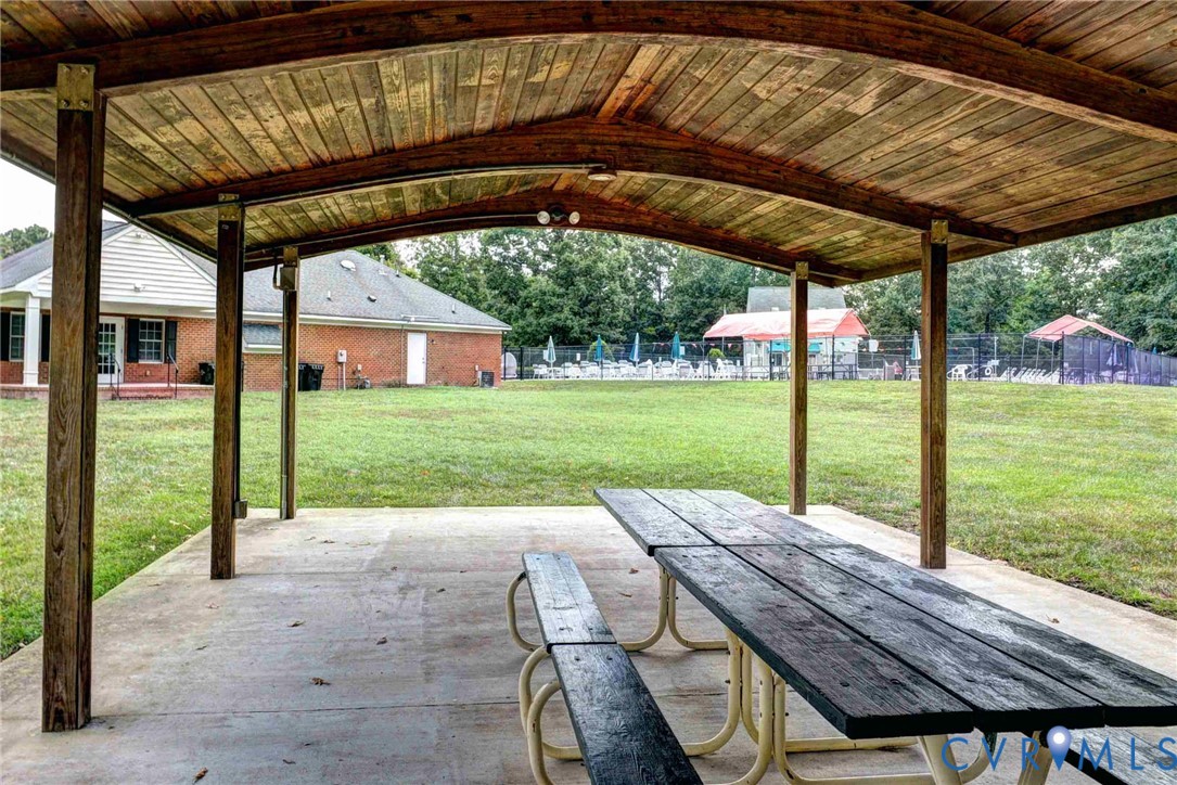 4015 Cold Spring Road Williamsburg, VA 23188 - Photo 55 of 57 Outdoor covered patio area featuring a slatted woo